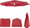 A red umbrella and its folded cover. Produktbild-Vorschau