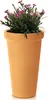 A terracotta-colored planter filled with pink flowers and green foliage, set against a white background. Náhľad obrázku produktu