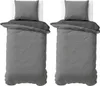 Two sets of bedding laid out on white surfaces. Produktbild-Vorschau