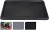 A black boot tray with a textured surface, shown from a top-down perspective. Below the main image are three smaller inset images showing the tray in use in a car trunk, and two color swatches (grey and black). Náhled obrázku produktu