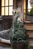 Two metallic spheres on stakes are placed in a basket with evergreen plants, suggesting outdoor decoration. Produktbild-Vorschau
