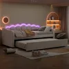 A bedroom scene featuring a daybed with a pull-out trundle, decorated with ambient lighting. Produktbild-Vorschau
