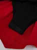 Close-up of the crotch area of a black bodysuit with red fabric attached. Podgląd zdjęcia produktu
