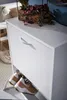 A white shoe cabinet with shoes inside and a plant on top. Produktbild-Vorschau