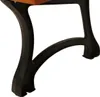 A close-up view of a black cast iron bench leg with a wooden seat. Produktbild-Vorschau