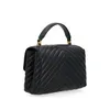 A black quilted handbag with a top handle is shown against a white background. Voir les images du produit