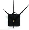 A black clock movement with three hands and a brass center nut, set against a white background. Produktbild-Vorschau