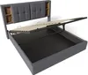 A grey upholstered bed frame with the mattress support mechanism lifted to reveal storage space underneath. Produktbild-Vorschau