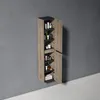 A tall, narrow corner cabinet with open doors, displaying various bottles and two folded towels on the bottom shelf, mounted on a gray wall. Anteprima dell’immagine prodotto