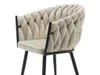 A close-up studio shot of a modern beige upholstered chair with a black metal frame and a distinctive braided backrest. Podgląd zdjęcia produktu