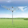 A rotary clothesline stands in a grassy field under a blue sky. Anteprima dell’immagine prodotto