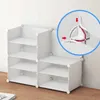 A white modular storage unit with multiple shelves, shown against a light gray wall and wooden floor. Náhľad obrázku produktu