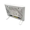 The back of a white Zyxel wireless router is shown, resting on a white stand. Podgląd zdjęcia produktu