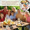 A family is enjoying an outdoor meal with food and drinks on a table. Produktbild-Vorschau