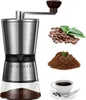 A coffee grinder is shown next to coffee beans, ground coffee, and a cup of coffee. Produktbild-Vorschau