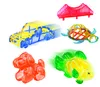 A collection of colorful, translucent plastic toys including a car, a dog, a fish, a turtle, and a bridge. Podgląd zdjęcia produktu