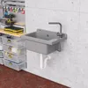 A utility sink mounted on a concrete wall in a workshop or garage setting, with storage bins and tools nearby. Náhľad obrázku produktu