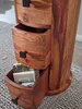 A close-up view of a wooden cabinet with open drawers. Produktbild-Vorschau