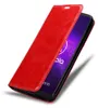 A red flip case for a smartphone is shown open, revealing the phone screen. Náhľad obrázku produktu