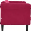 Side view of a red velvet sofa. Produktbild-Vorschau