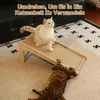 Two cats interacting with a wooden and sisal scratching post/bed on a carpeted floor. Produktbild-Vorschau