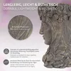 A close-up marketing image of a bronze-colored planter shaped like a woman's head, with text overlays describing its features. Náhled obrázku produktu