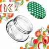 A collage of a glass jar and a green checkered lid surrounded by various fresh vegetables and herbs, with a white 'K' logo in the top left corner. Anteprima dell’immagine prodotto