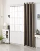 A room interior with a window covered by curtains, next to a white cabinet and a small table. Produktbild-Vorschau