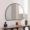 A mirror and decorative items on a console table. Náhled obrázku produktu