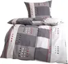 A stack of bedding with a geometric pattern. Produktbild-Vorschau
