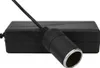 A black AC/DC voltage converter adapter with a silver rim is shown on a white background. Produktbild-Vorschau