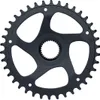 A black bicycle chainring with cutouts and teeth, isolated on a white background. Produktbild-Vorschau