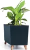 A dark blue planter with wooden legs holding a green plant. Produktbild-Vorschau