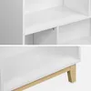 Close-up views of a white bookshelf with wooden legs. Produktbild-Vorschau