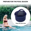 A woman is sitting by a pool with a skimmer basket in the foreground. Produktbild-Vorschau