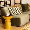 A living room scene with a sofa, side table, and decorative pillows. Produktbild-Vorschau