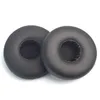 Two black ear pads for headphones are shown against a white background. Produktbild-Vorschau