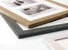 Close-up view of multiple photo frames stacked on a white surface. Anteprima dell’immagine prodotto