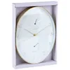 A wall clock with a thermometer and hygrometer, presented in its packaging. Produktbild-Vorschau