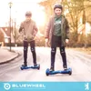 Two children riding hoverboards on a street. Produktbild-Vorschau
