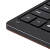 A close-up view of a black keyboard with brown trim. Anteprima dell’immagine prodotto