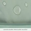 Close-up of a green fabric with water droplets, indicating water-repellent properties. Produktbild-Vorschau