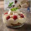 Dessert im Glas mit Himbeeren und Kandylas Halva Stückchen Produktbild-Vorschau