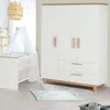 A nursery room setting with a crib and a wardrobe. Produktbild-Vorschau