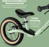 Close-up of a child's balance bike, highlighting its features with text overlays. Produktbild-Vorschau
