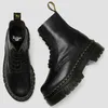 A pair of black Dr. Martens boots are shown against a white background. Anteprima dell’immagine prodotto