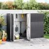 A metal garden shed with tools inside, set in a garden environment. Náhled obrázku produktu