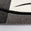 A close-up view of a textured rug with a geometric pattern. Anteprima dell’immagine prodotto