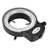 A black ring light with LEDs, designed for microscopy, is shown against a white background. It has a power switch and a connector port. Voir les images du produit