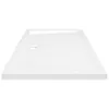 A white shower tray with a textured surface and a drain hole. Produktbild-Vorschau
